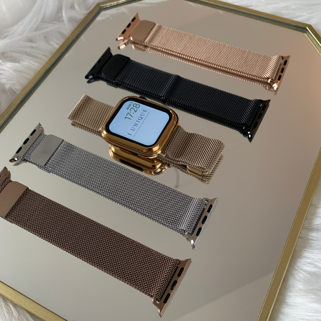 Aufnahme von Watch Bändern in den Farben Gold, Silber, Schwarz, Rose Gold und Bronze von oben, Bänder sind kompatibel mit Apple Watch